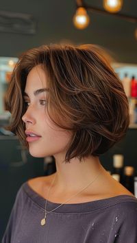 Upgrade your look with the sleek and modern Stacked Feathered Bob! This edgy haircut features feathered layers that create volume and movement, while the stacked back adds a stylish twist. Ready to redefine your style? Click the pin and follow us for more trendy hair inspiration! #StackedFeatheredBob #HairInspo #TrendyHaircuts #FeatheredHair #FollowUs