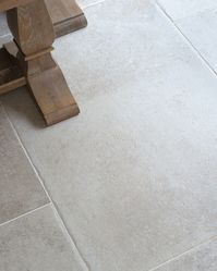 The Provence collection offers stone effect porcelain paving with a subtle tumbled appearance. Together with the character and variation from tile to tile, this soft tumbling effect lends itself beautifully to rustic, country gardens and patios. The Provence Crema tumbled porcelain has an ivory cream base with soft hints of grey - the detailed print and subtle variation between the pavers makes this stone effect outdoor tile hard to distinguish from a natural limestone. Rectified: Yes R rating: