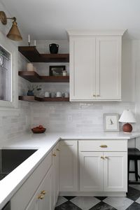 White cabinets. Brushed gold finishings. Natural wood shleves. Checkered flooring. White counter tops & Bedrosian backspalsh Kitchen inspiration