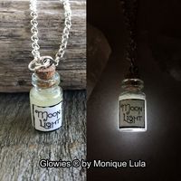 "Moonlight white glow in the dark potion jar necklace. Glass bottle measures 1\", included UV charging keychain light. You may also choose from some of my other potion necklaces for convenience on this listing. Comes on hypoallergenic 20\" link chain."