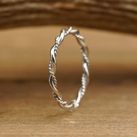 THE BRAIDED BAND gives off a soft, romantic feel. It's dainty, stylish, and a great ring to wear on its own or stacked with others! CLICK HERE to see more women's bands! ABOUT THIS RING Metal: 316L Stainless Steel, Rhodium Plating Color/Finish: Silver, Polished Width: 2mm