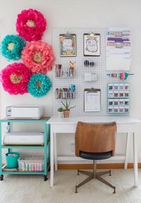 Lovely and beautiful home office design and decoraions. Decorate your work space with quirky accessories—like these oversized paper flowers—to make it feel truly unique.