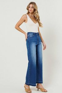 * High-rise, wide-fit jeans featuring asymmetrical leg opening detail with tacked and released raw edge cut * Classic 5-pocket construction, and a zip-fly closure * Rise: 11.75", Inseam: 30" * Model is 5'9" and wearing a size 3 * True to size * Goes well with a tank top and sneakers