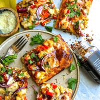 Easy BBQ chicken flatbread is flavor loaded, quick and super filling for an easy weekday meal. Use rotisserie chicken or make your own.