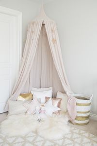 Numero 74 canopy with pillows in girl room More