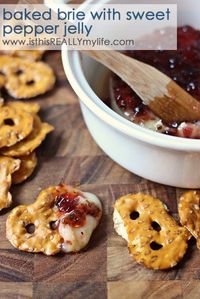 Baked brie with sweet pepper jelly. Super easy appetizer; especially yummy if you use local pepper jelly from the farmers market