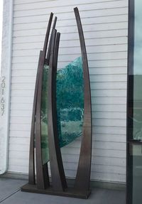 Reflections, cast glass sculpture Heather Cuell outside of The Tin Box in Canmore AB | Effusion Art Gallery + Glass Studio