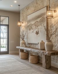 Rustic style entryway features a limestone wall. In front