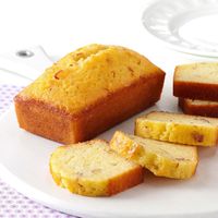 Using smaller pans and topping the cakes with amaretto glaze makes these loaves so incredibly moist. —Donna Lamano, Olathe, Kansas