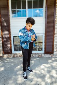 Vintage street style: custom jean jacket (thrifted), vintage blouse, black skinny jeans, black Vans sneakers.