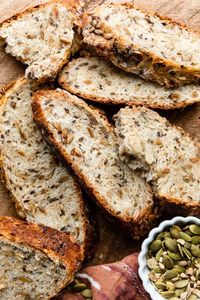 This no knead seeded oat bread is crusty on the outside, chewy on the inside, and has the most delicious crunch in every bite, thanks to 3 types of seeds. This is a hearty loaf of bread that doesn't require any kneading, and there's hardly any hands on work. Recipe on sallysbakingaddiction.com