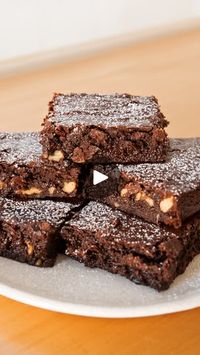 251K views · 837 reactions | Do you hear that? It's the sweet sounds of National Brownie Day. 😋🍫

~
Ingredients: 

2 cups of chocolate
1 cup of butter
1 1/2 cups of sugar
3 eggs
1 tsp of vanilla
1 cup of flour
1/2 cup of powdered chocolate
1 tsp of salt
3.5 oz of chopped nuts

Bake for 18 to 20 minutes at 350°F | Tastemade