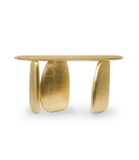 Embrace ancient allure with our Ardara Console Table, inspired by the enigmatic Dolmens. Finished in gold leaf with a gloss varnish, this modern marvel steals the spotlight in any room, becoming the golden focal point of your modern interior design.