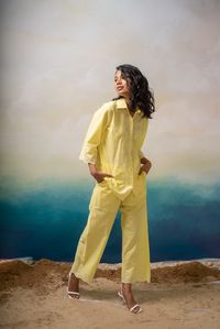 Introducing our lemon yellow schifli detail co-ord set, a vibrant ensemble that exudes freshness. This set features intricate schifli detailing, adding a touch of elegance. The pants and sleeves are adorned with stylish cut-out details at the ends, creating a playful and trendy look. Embrace the zest of this fashion-fo