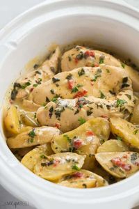 This Creamy Italian Crockpot Chicken and Potatoes is simmered in the most incredible creamy sauce of roasted red peppers, spinach and Italian herbs. It's a dump and go meal in one! #crockpot #slowcooker #chicken #chickenbreast #healthy #dinner #recipe