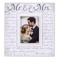 Mr. & Mrs. printed in a modern charcoal Gray script. This frame also the 1st Corinthians verse, Love is Patient, Love is Kind. screen printed in light Gray script. This freestanding, easel backed picture frame will display perfectly on a table or shelf. Picture Frame includes a durable glass front that will protect and showcase your precious photos for years to come. Maldens Mr. & Mrs. Corinthians Verse picture frame also makes the perfect Wedding gift! Size: 5" x 7".  Color: White.