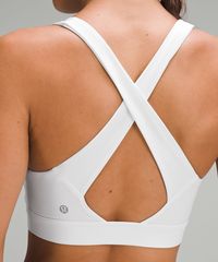 Get after it. This v-neck, cross-back bra supports you during any and all training sessions. Designed for Training. Intended for medium-impact activities. Pockets for optional, removable cups. Cross-back straps allow for full range of movement.