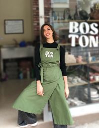 A custom long painters apron tailored for pottery and art enthusiasts. This apron is crafted to be a Personalized Water and Stain Repellent solution tailored for pottery activities.