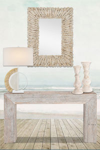 Natural materials and subdued hues create a natural coastal entryway fit for any beachy escape home. #natural, #coastal, #consoletable, #mirror, #lamp, #candleholders