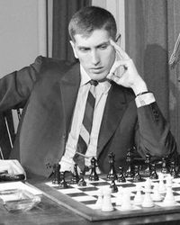 Bobby Fischer plays chess, wears striped tie.