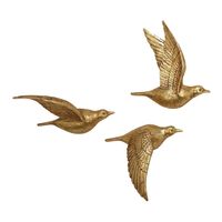 Beautify your space with these three lustrous birds in flight, a sculptural take on wall decor. Made of lightweight yet durable polystone and finished in glittering gold, this 3D bird wall art set can be displayed in a host of arrangements to best suit your space. Color:Gold. Also could be used for decoration,wall art,nature decor,bird decor,bird wall art,gold wall decor. By Cost Plus World Market.57006093