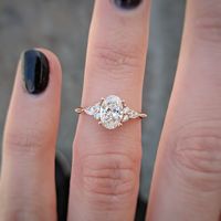 Cushla Whiting on Instagram: “CW BESPOKE | A unique engagement ring holding a 0.9 carat oval diamond, with two small diamonds and a pear shaped diamond on each side 💞 .…”