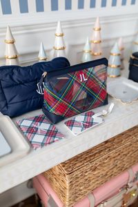 PLAID CLEAR POUCH | www.markandgraham.com A clear travel favorite, this versatile pouch is the perfect way to keep your small essentials organized. With vegan leather trims and shadow printed sticker decal monogram, this little pouch can be used as a clutch, tucked into your handbag as an organizer or taken with you when you travel to make airport security a breeze – say goodbye to ziplock bags! #travelorganization #monogram