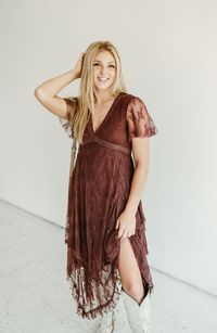 This maxi dress features a deep V-neck and short sleeves, made from a fabric blend of 90% nylon and 10% spandex. Its boho western style pairs perfectly with cowgirl boots. Elevate your wardrobe with this embellished lace hem dress.