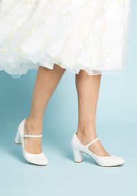 Every piece of your ensemble is thoughtfully selected, so it's no wonder these embroidered heels from Chelsea Crew made the cut! Adding a touch of luxe to your look with their vintage-inspired silhouette awash in an ivory hue with textured forals, these Mary Janes please even the most particular stylistas.