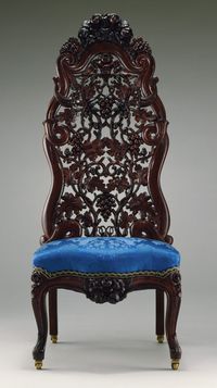 Slipper Chair. This chair, intricately carved with grapes on the vine, is a delightfully fanciful example of the Rococo Revival style. Such furniture was described at the time it was made as being in "the modern French style" because it borrowed elements from the eighteenth-century Rococo, such as curvaceous cabriole legs, strong C- and S-curves and scrolls, and the extravagant use of carved naturalistic ornament.