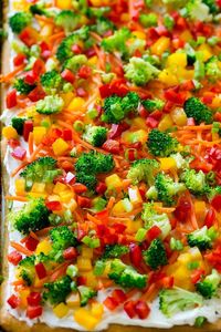 This veggie pizza is a crispy crescent roll crust topped with ranch flavored cream cheese and crunchy colorful vegetables. An easy appetizer that's perfect for serving a crowd!