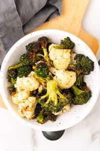 Get your daily dose of veggies with air fryer broccoli and cauliflower! Seasoned to perfection with Italian seasoning and garlic powder, this recipe is both easy and healthy.