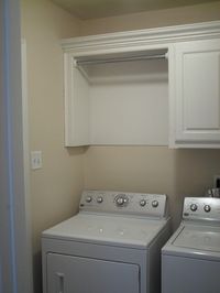 Hanging space above the dryer, great idea.