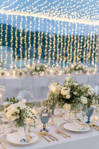 Picture this: A lush circular ceremony arch of white roses on the beaches of Phuket and an intimate outdoor wedding reception under twinkling lights. This gorgeous destination wedding has us packing our bags and jet setting to Thailand!