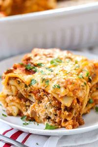 Homemade lasagna is the best way to bring the family together! Nothing says family dinner like tender pasta, a cheese filling, and a rich meaty sauce! Serve with a side salad and some garlic bread for the perfect meal. #lasagna #homemadelasagna #easylasagna #spendwithpennies