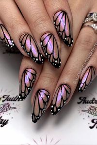 These long almond nails showcase a dazzling pinkish chrome base by @audreyfaithartistry adorned with intricate butterfly wing patterns, adding a touch of elegance and whimsy to your manicure. Perfect for those seeking a sophisticated yet playful nail design. Discover endless inspiration for your next manicure with Nailustrous – explore our collection of the best 25 butterfly nail design ideas now!