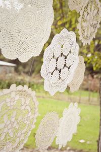 hanging doilies- attached on the vintage doors behind our sweetheart table