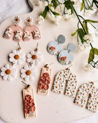 Noelle Earrings on Instagram: "my most favorite collection of all time ✨🌿🌼🌷🌞 launching this Friday at 6 PM EST! Which style is your fave so far? I shared almost every style I’ve made so far to my stories, so head there to see the full collection! #polymerclay #polymerclayearrings #polymerclayartist #polymerclaycreations #clayearrings #polymerclayjewelry #smallbiz #smallbizowner #smallbusinessowner #shopify #shopifyseller #smallbusiness #shopsmall #smallbusinesssupport #youngbusinessowner #bo