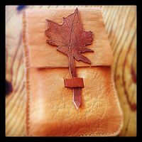 Leather iPhone case in hand-stitched tanned leather with maple leaf application. $34.00, via Etsy.