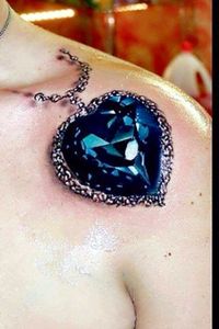 Blue Diamond tattoo from Titanic on shoulder. I don't want this at all but I want a dark blue 3D gem. This one is done nicely.