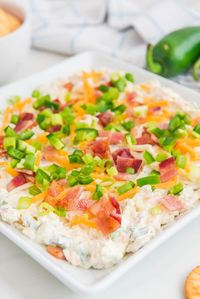 This Cold Jalapeno Popper Dip with Bacon is creamy and cheesy with a delicious spicy kick. A perfect blend of jalapenos, cream cheese, shredded cheese, and savory bacon makes this the ultimate party appetizer.