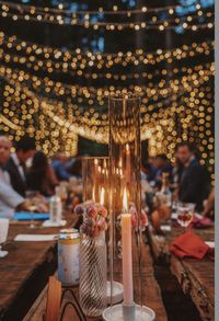 Sparrow Valley Retreats family style costum made table decorated with beautiful natural candle light and light tunnel.