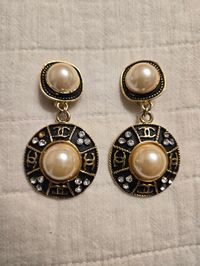 Add a touch of timeless elegance to your collection with these Coco Chanel vintage runway earrings. These exquisite pieces feature classic Chanel design elements, making them a perfect addition for any vintage jewelry enthusiast. Elevate your style with these iconic and luxurious earrings that capture the essence of Chanel's legendary fashion legacy.