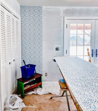 blue and white wallpaper on wallpaper table in bedroom