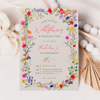 Add a touch of bohemian elegance to your baby milestone, 2nd birthday with our Modern Chic Boho Bright Elegant Colorful wild flowers second birthday Invitation. Featuring pink, red, green, and purple hues botanical flowers inspired by wildflowers and watercolor rustic gardens with subtle greenery and modern boho script typography.