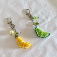 A cute and unique 3D citrus keychain to hang all your keys with! For ladies who love to accessorise their purses, this lovely lemon or lime slice keyring will be perfect to add a little personality to your bags! The keychain is made with high quality Japanese beads, and stainless steel findings for parts that directly in contact with the beads. Glass pearls and leaves are also added to give the keychain a more flirty look.  Listing is for ONE(1)  keychain!