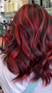 Fueling hair envy with these fiery red highlights! ❤️‍🔥 Transform your style with Hair Cuttery Salons. #RedHighlights #RedHair #RedandBlackHair