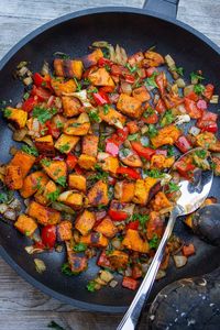 This quick and easy Vegetarian Sweet Potato Hash recipe with onions, garlic, peppers and smoked paprika is a delicious side, main, breakfast item or filling. #sweetpotatohash