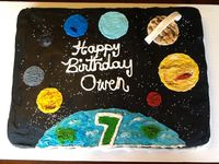 Hand painted buttercream (except for saturns ring, gumpaste) solar system cake. I had to do my homework on this one b/c my 7 year old client knows his stuff about the planets. It turned out great & he loved it!!!