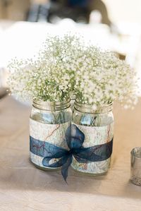 Map & Baby's Breath Centerpieces With Navy Ribbon | Photo: Shelley Marie